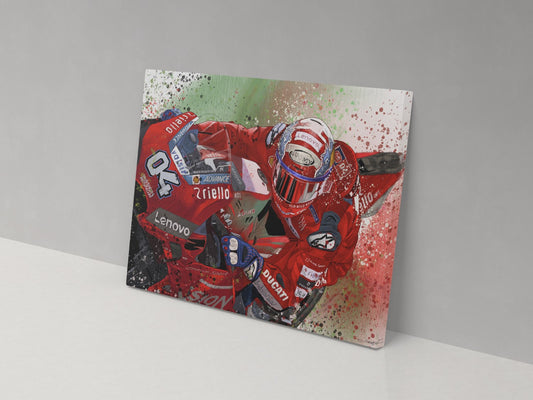 A canvas print featuring a colorful artistic representation of a motorcycle racer in mid-action, predominantly red with white and black accents.