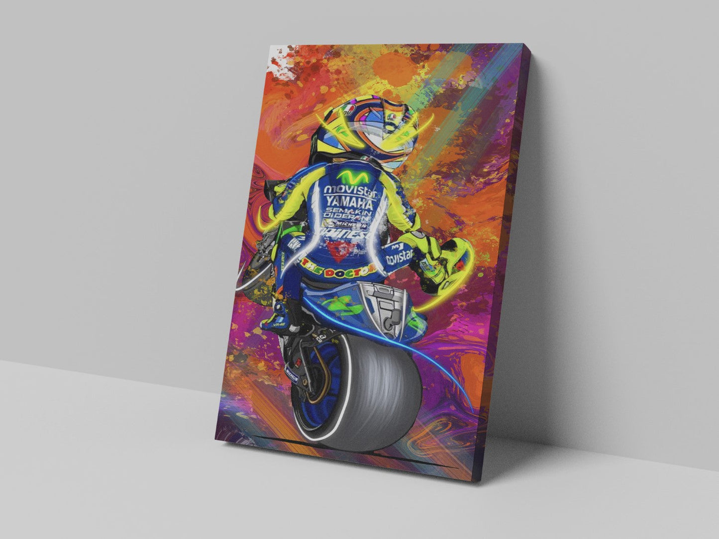 A canvas print featuring a colorful artistic depiction of a motorcycle racer in motion, with a predominantly blue and yellow color scheme.