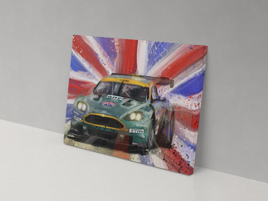 A canvas print featuring an Aston Martin DBR 9 in front of a Union Jack background, mounted on a wall.