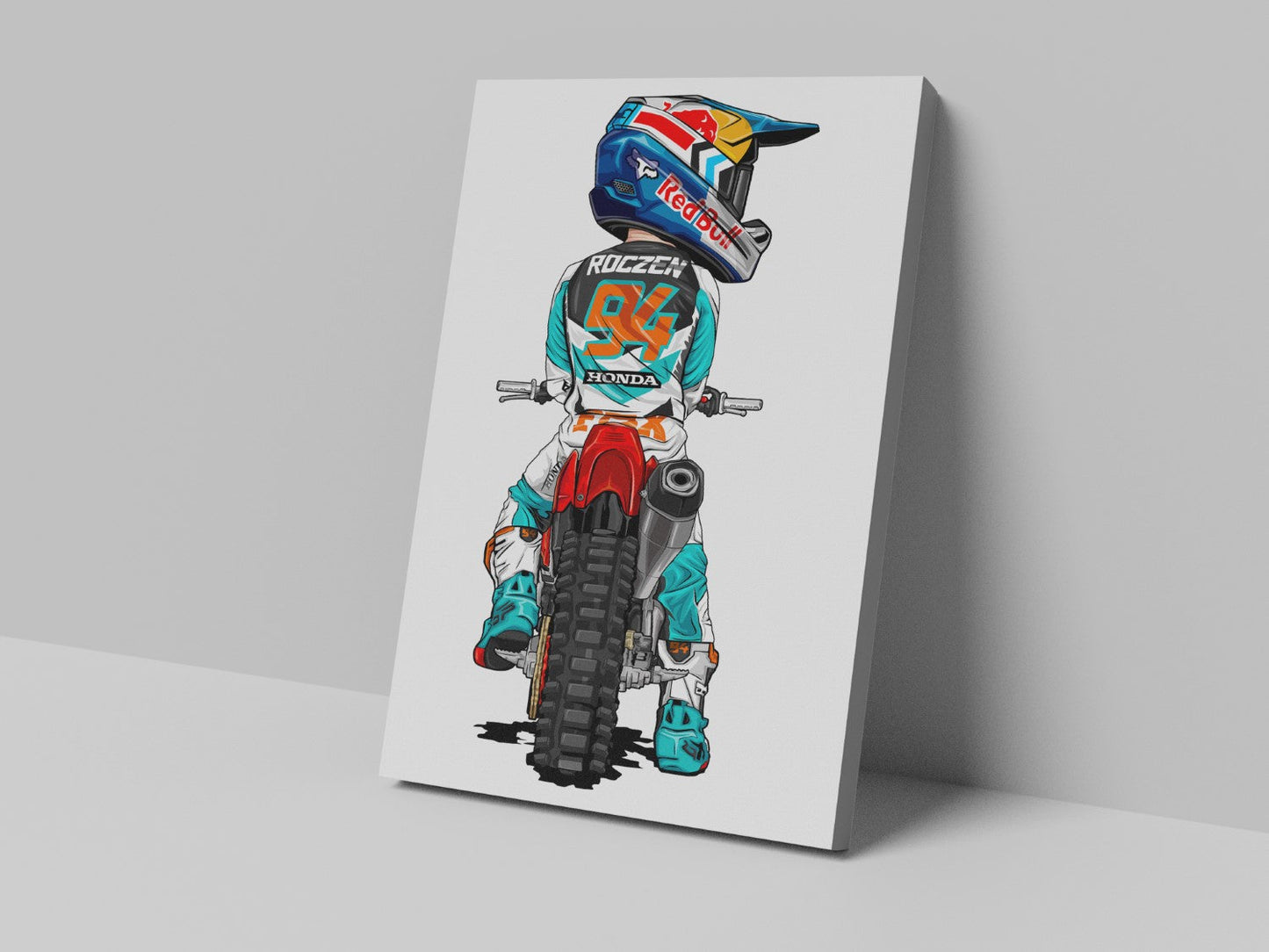 A canvas print featuring a colorful cartoon illustration of a motocross rider on a white background, mounted on a frame.