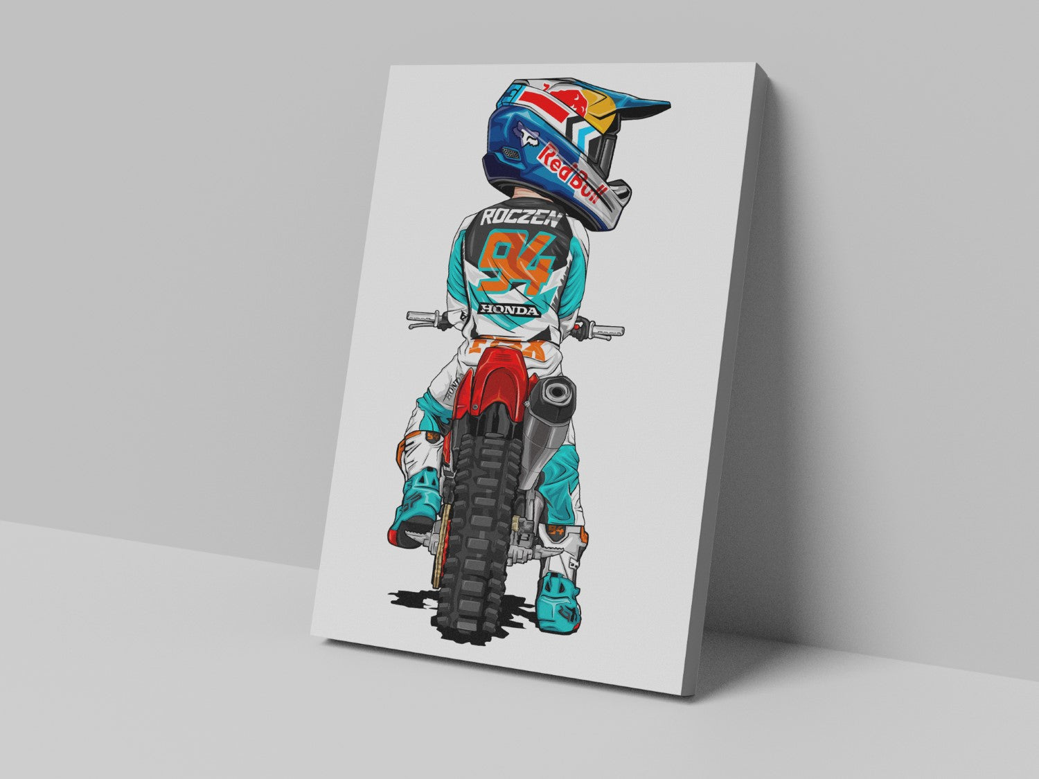 A canvas print featuring a colorful cartoon illustration of a motocross rider on a white background, mounted on a frame.