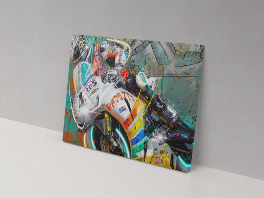 A canvas print featuring a colorful illustration of a motorcycle racer in action, mounted on a wall.