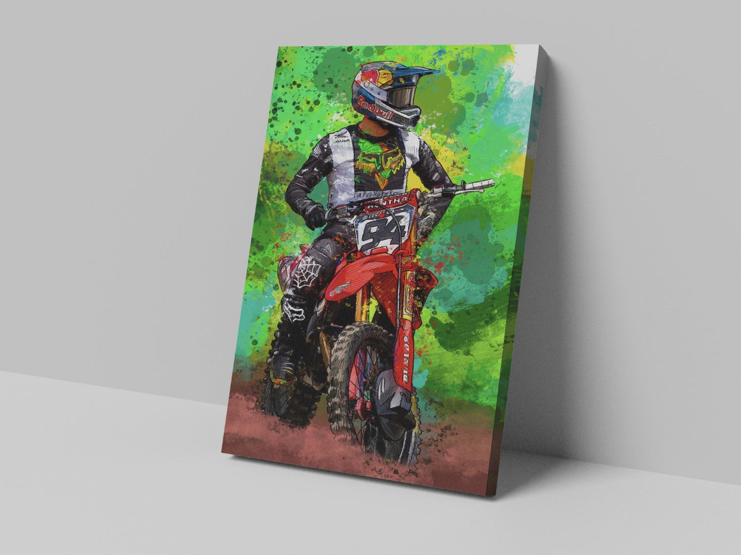 A canvas print featuring a colorful illustration of a motocross rider on a red motorcycle with a green and yellow background.