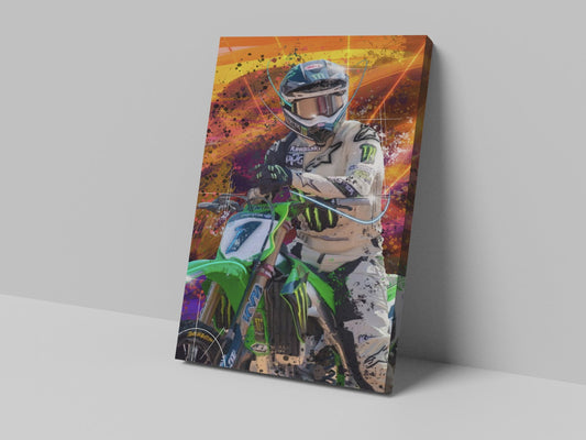 A canvas print featuring a colorful illustration of a motocross rider on a green motorcycle with an orange and yellow abstract background.