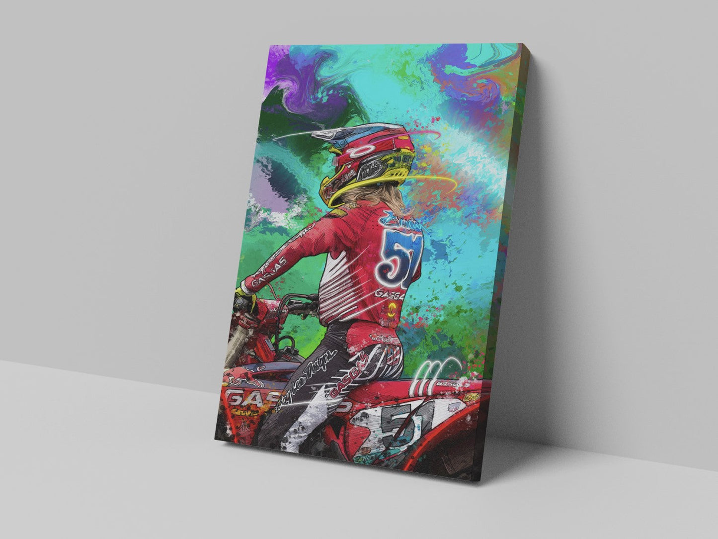 A canvas print featuring a colorful artistic depiction of a motocross rider in red gear, with an abstract background.