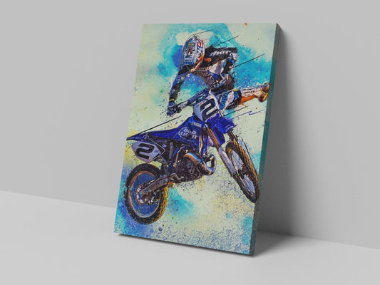 A canvas print of a motocross rider in mid-air, performing a trick with his motorcycle.