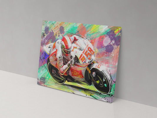 A colorful canvas print of a motorcycle racer in motion, with abstract splashes of multiple colors.