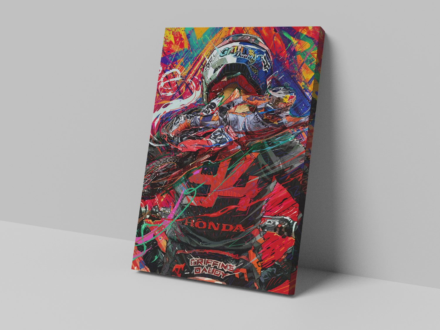A canvas print featuring a colorful, detailed illustration of a motorcycle with the brand name 'Honda' prominently displayed, leaning against a white surface.