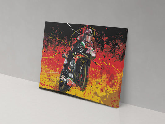 A canvas print featuring a colorful artistic representation of a motorcycle racer on a bike with a dynamic splash background in red, black, and yellow.