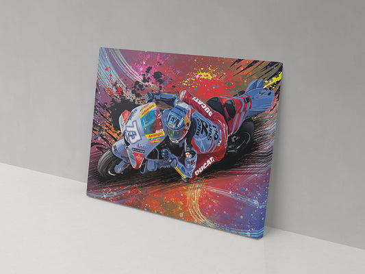 A canvas print featuring a colorful artistic depiction of a motorcycle racer in motion with abstract patterns and splashes of paint in multiple colors.